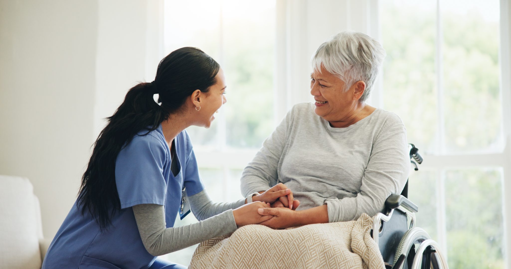 Caregiver supporting elderly client with compassionate care